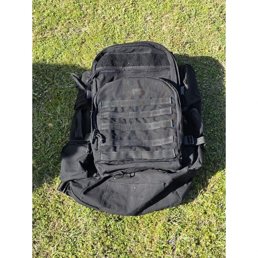 black tactical backpack is a Sandpiper of California Bugout Bag **see Pics**